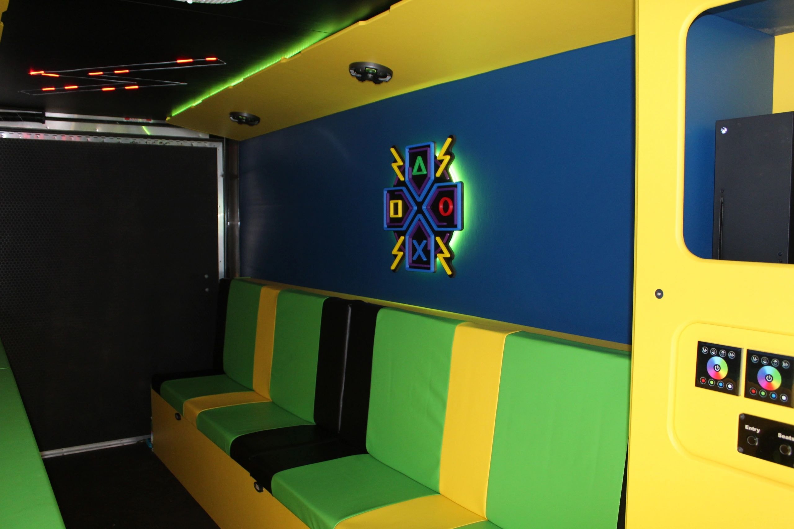 Game truck interior with gaming screens and seating
